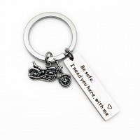 Drive safe style keychain with motor vehicles part